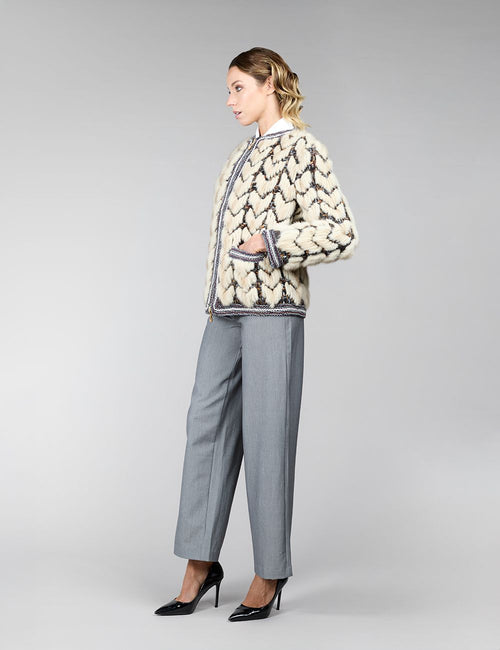 Veste réversible en vison, avec un motif géométrique, de couleur beige, mesurant 65 cm.