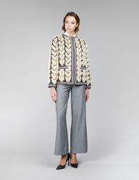 Veste réversible en vison, avec un motif géométrique, de couleur beige, mesurant 65 cm.