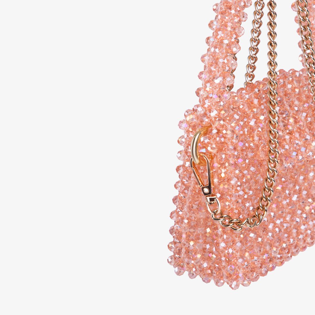 Sac fait à la main avec des micro cristaux roses