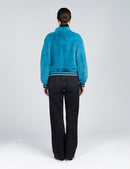 Bomber en vison avec fermeture éclair turquoise de 55cm